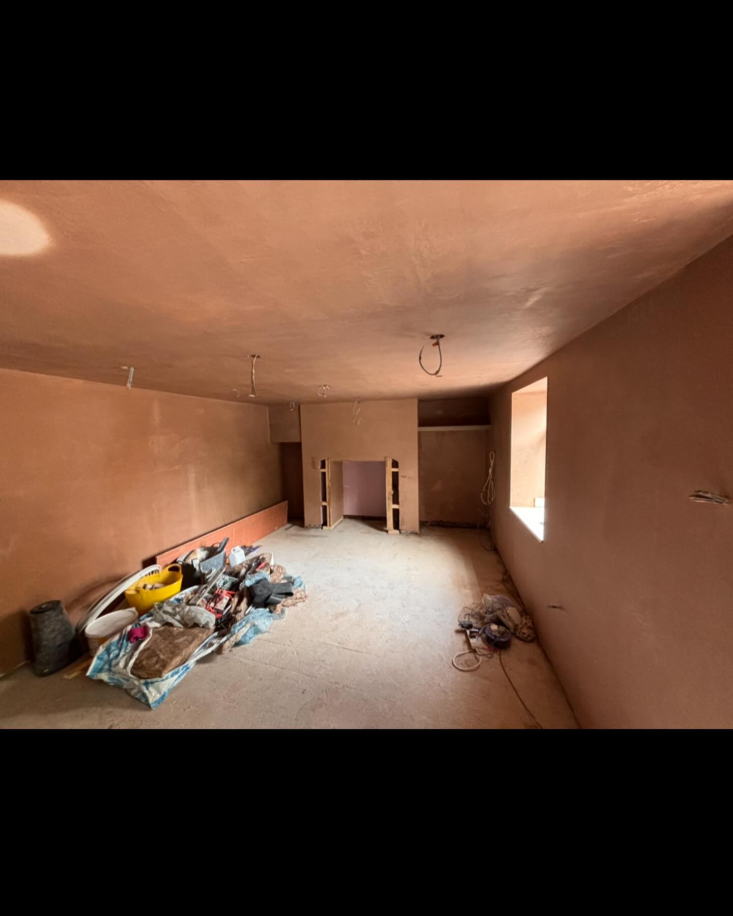 Interior room after fresh pink plaster skim