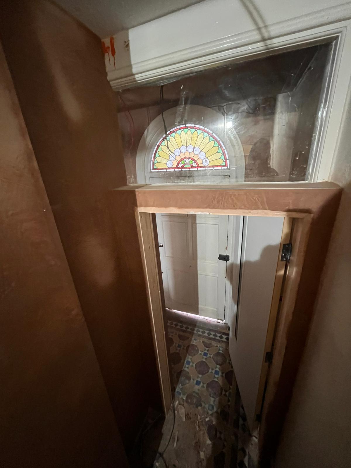 Period property hallway re-skim with stained glass arched fanlight