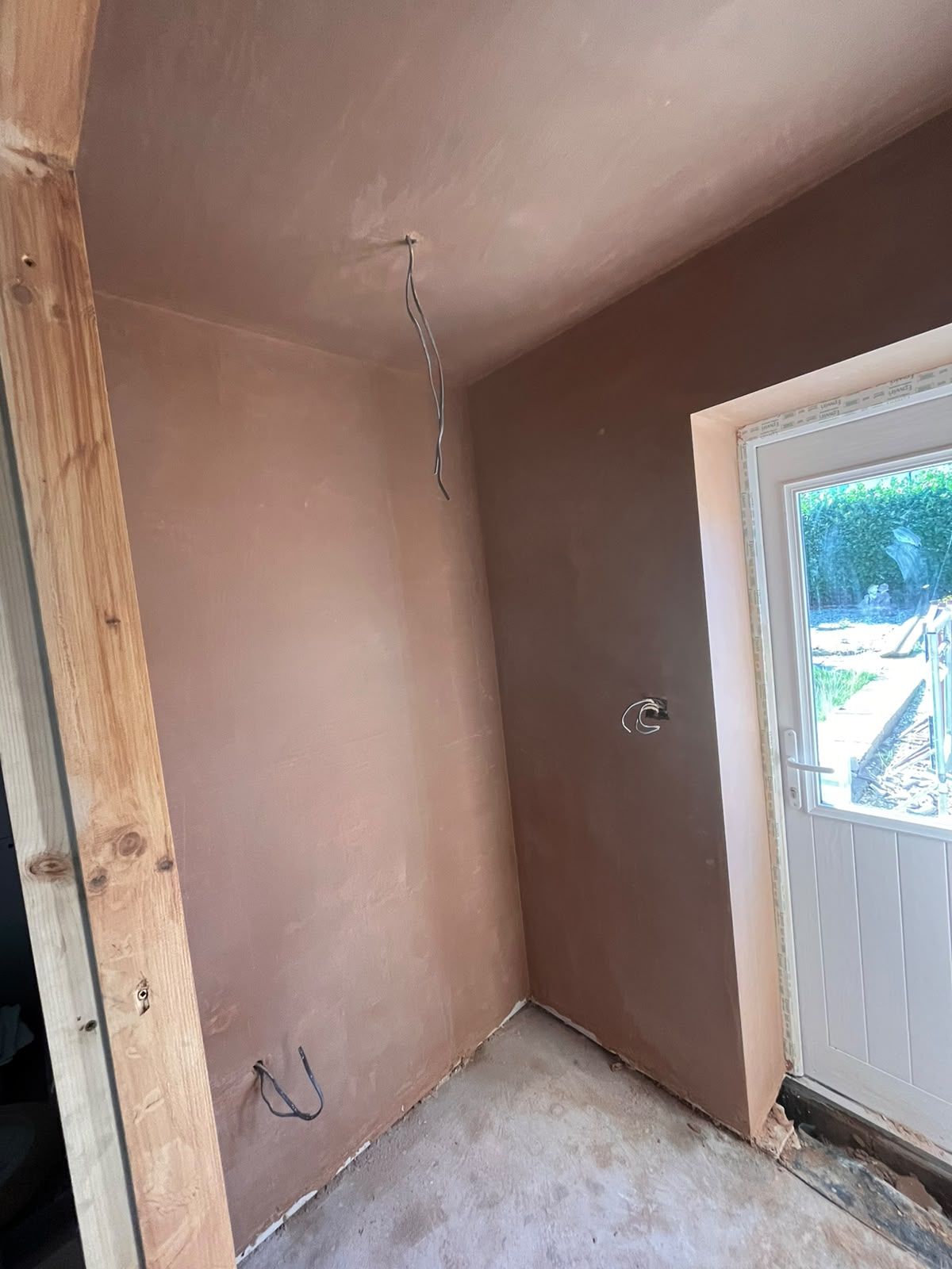 Rear lobby freshly skimmed around a new back door