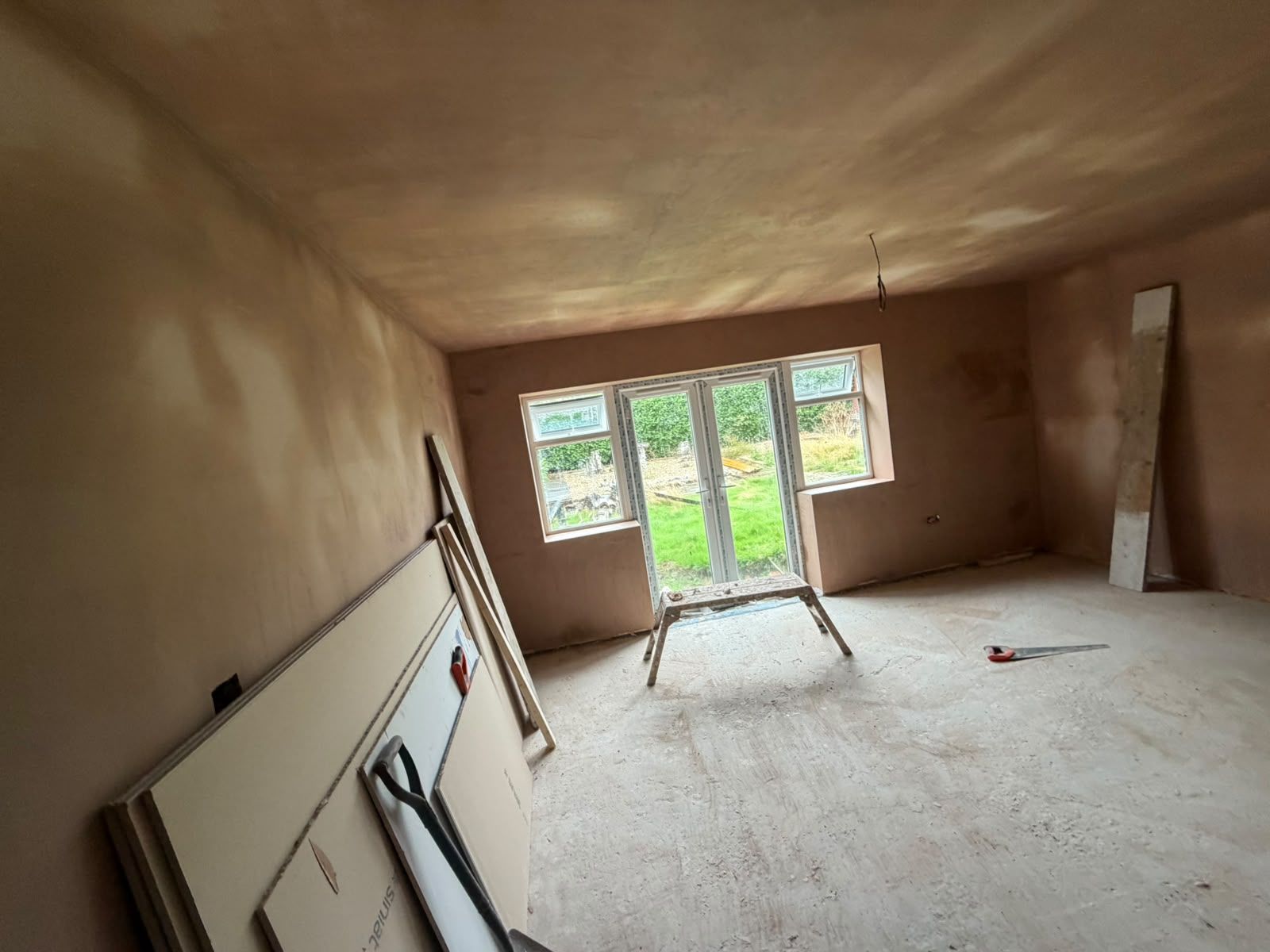 Garden room freshly skimmed around the french doors