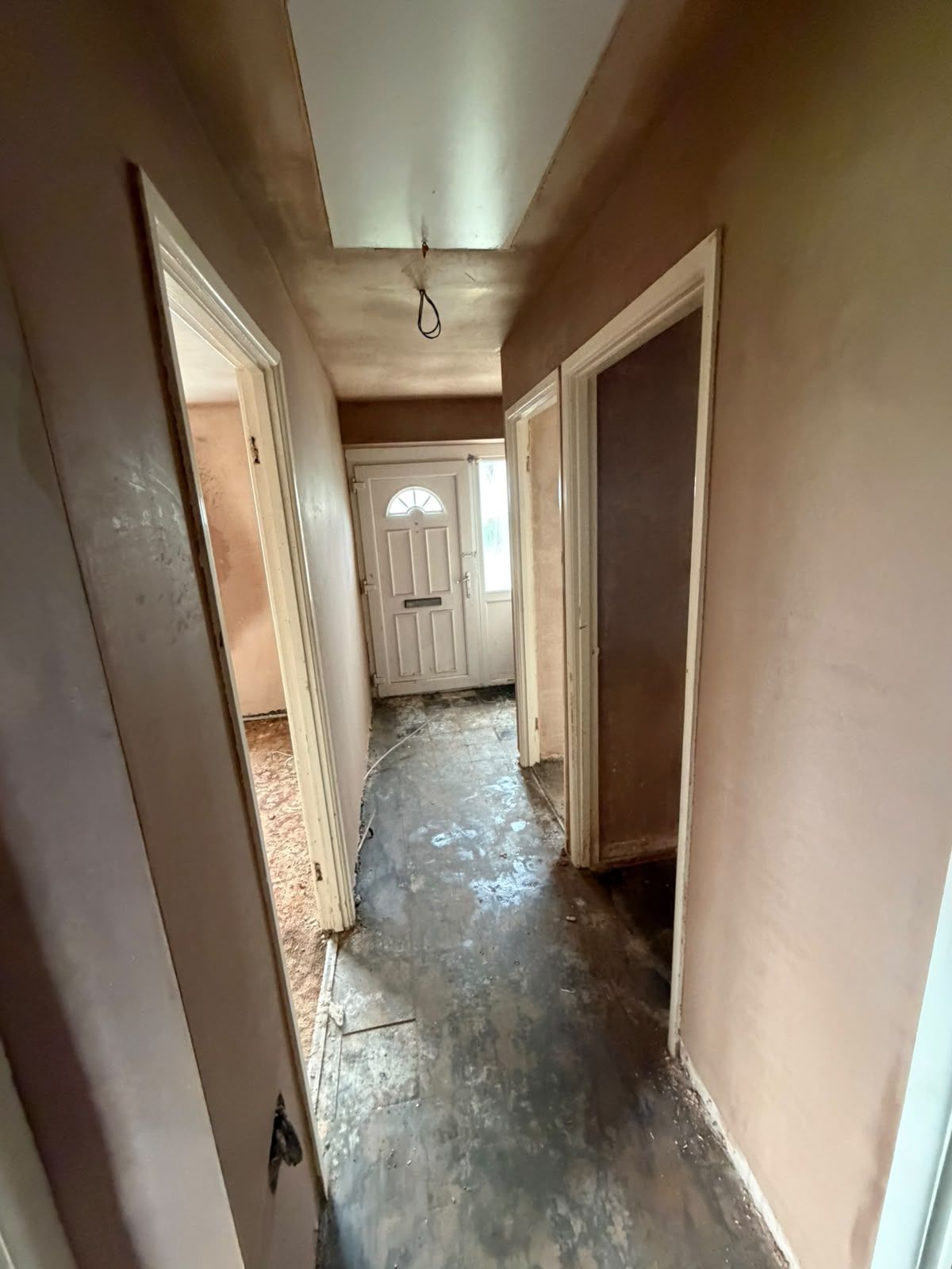 Hallway freshly skimmed with new door linings to each room