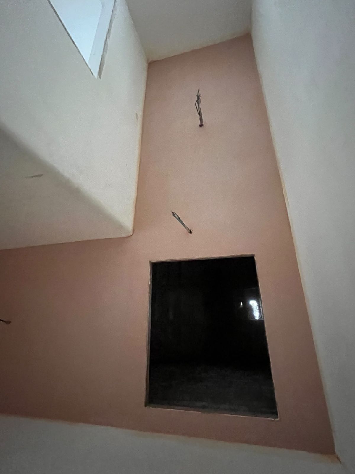 Landing ceiling freshly skimmed around the loft hatch opening