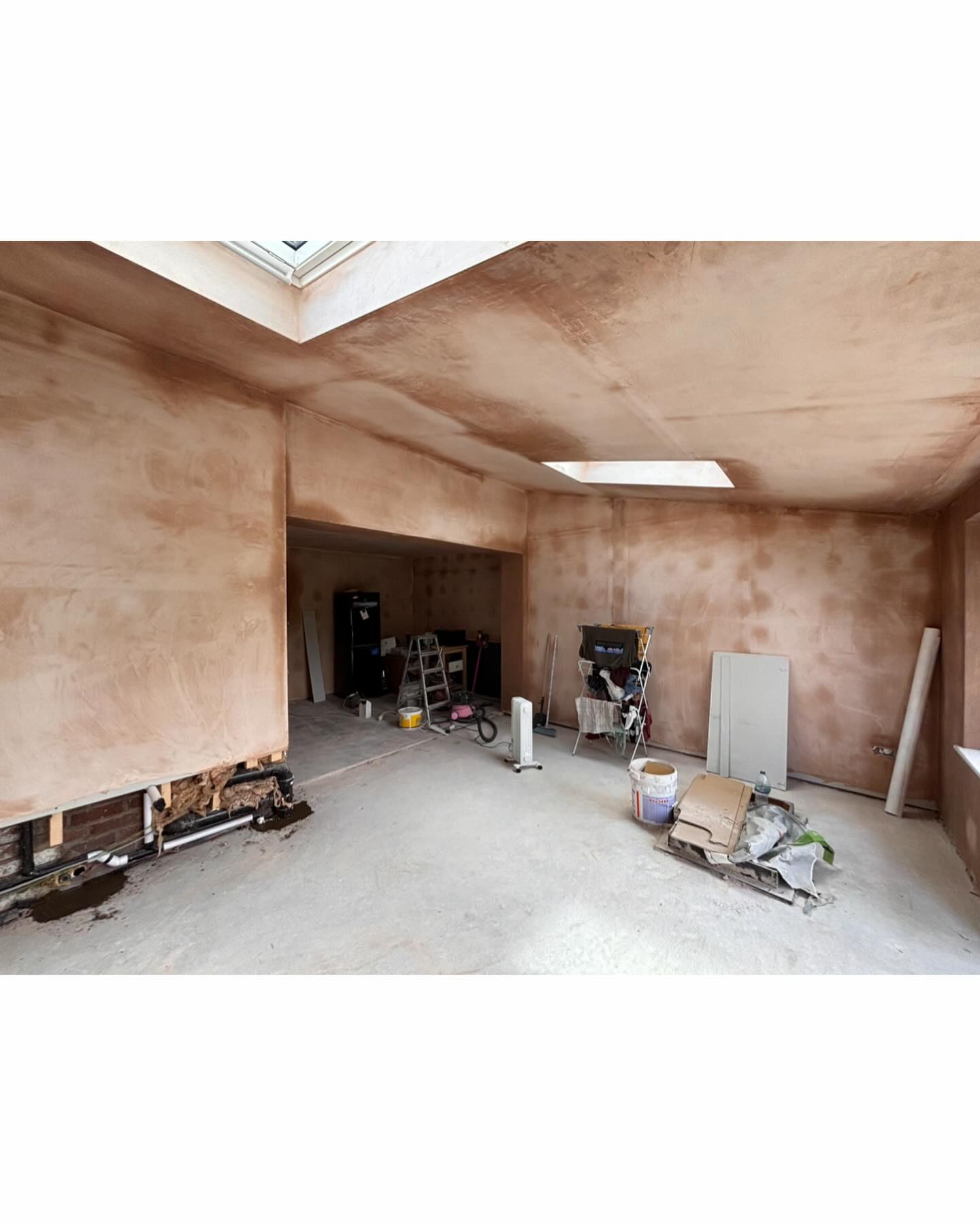 Large open-plan space freshly plastered