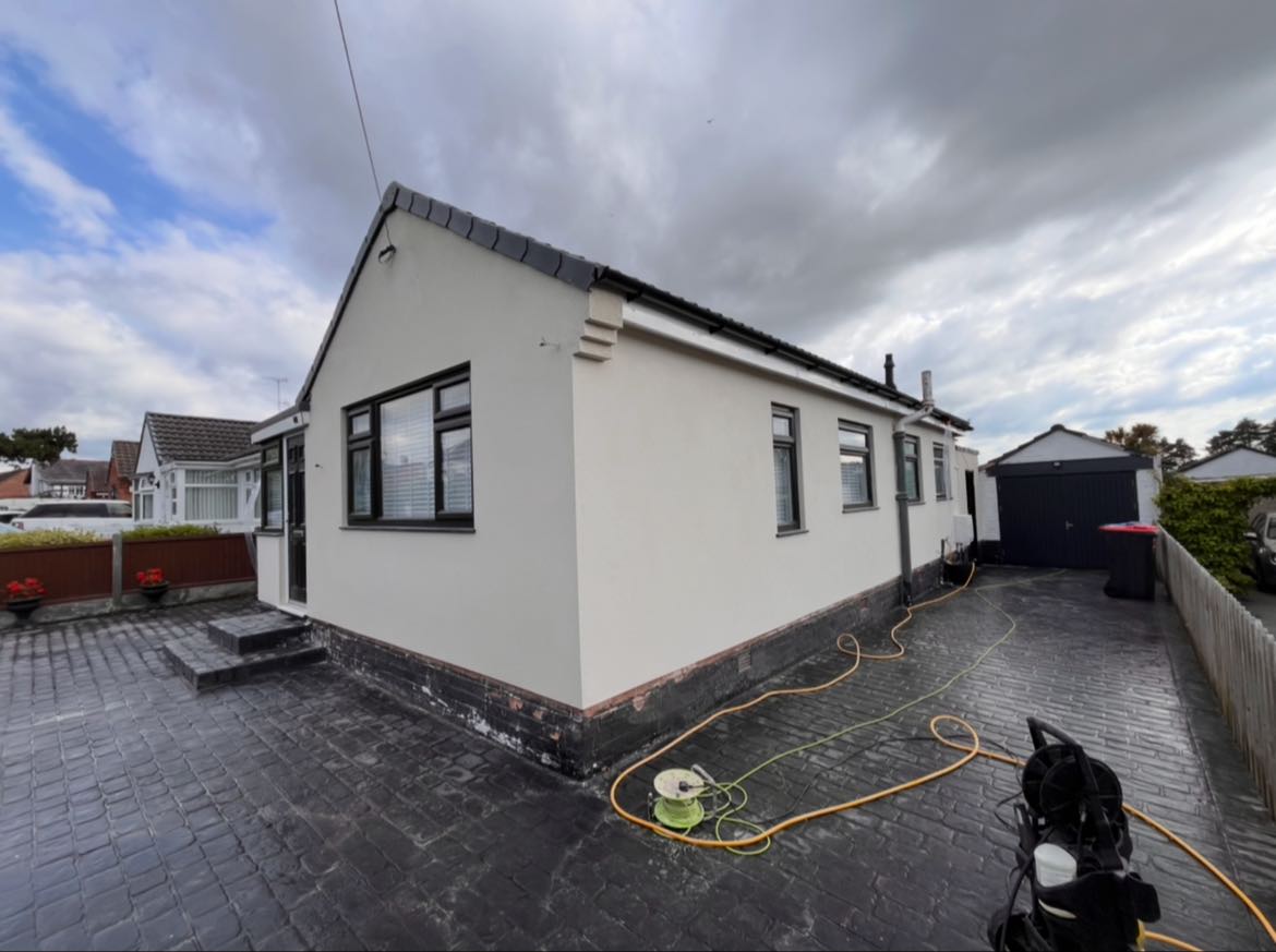 White rendered bungalow with printed concrete drive